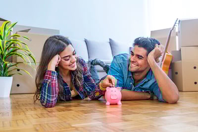 smiling-couple-with-piggybank-new-home smiling-couple-with-piggybank-new-home